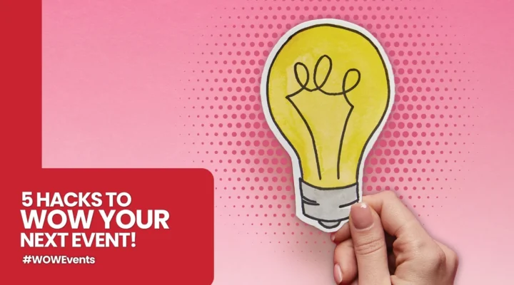 A hand holding a yellow paper cutout of a lightbulb against a pink background with halftone dots. To the left, a red text block reads '5 HACKS TO WOW YOUR NEXT EVENT! #WOWEvents'.