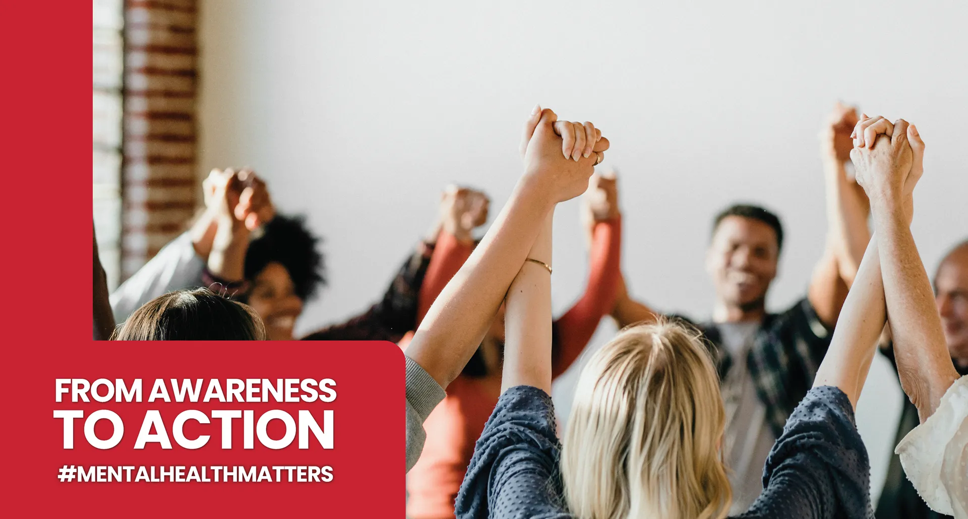 A diverse group of people standing in a circle, holding hands with their arms raised high in a gesture of unity and solidarity. A red graphic overlay on the left reads 'FROM AWARENESS TO ACTION' followed by the hashtag '#MENTALHEALTHMATTERS'.